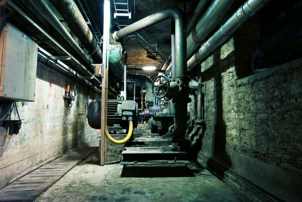 Old creepy, dark, decaying, destructive, dirty factory Asbestos filled commercial basement.